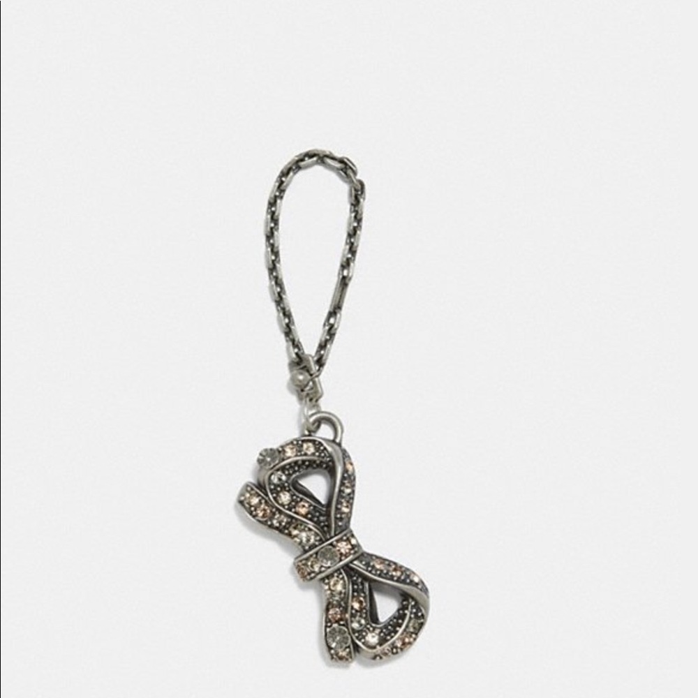 Coach X Celina Gomez metal bow hang charm